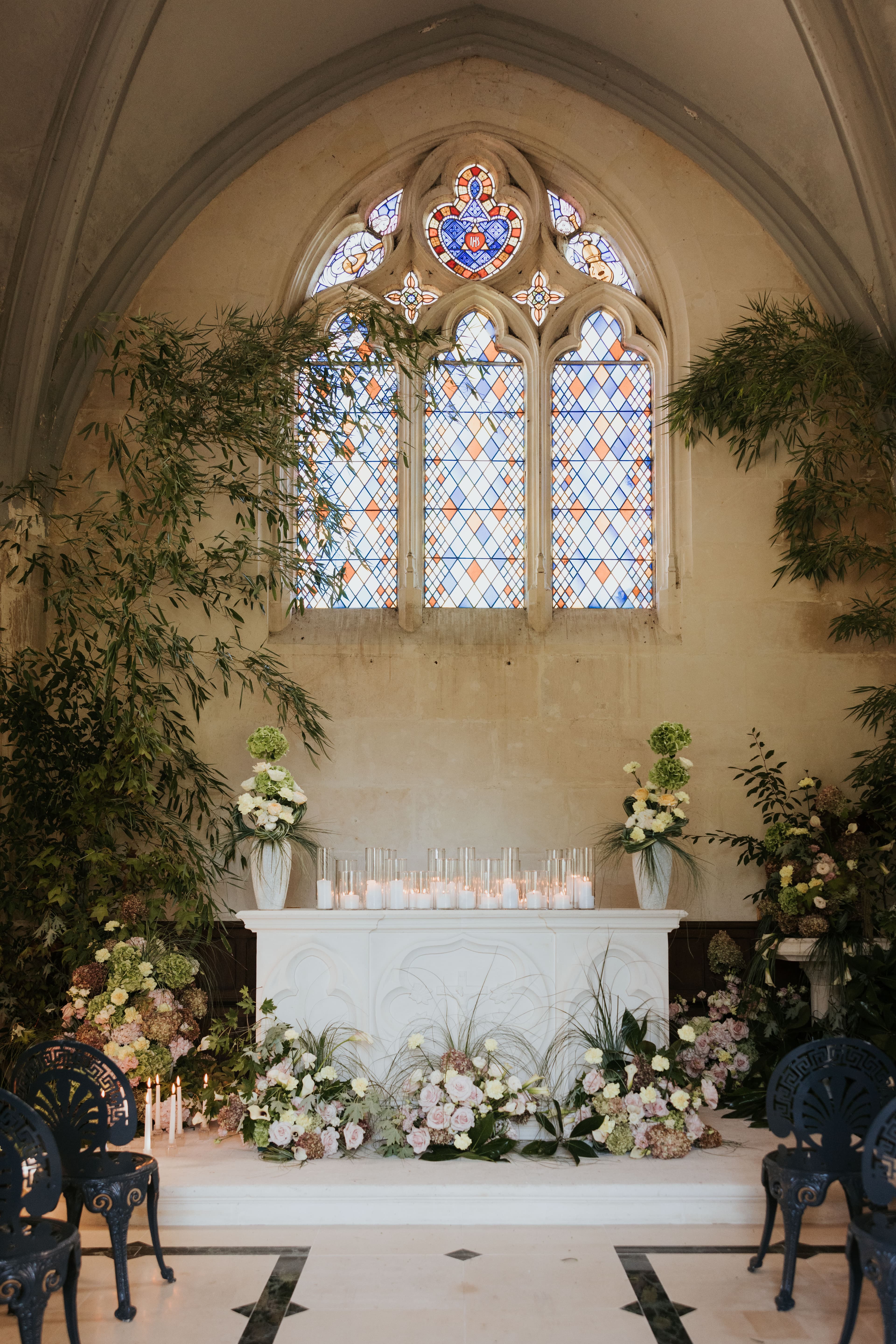 Chapel altar beneath stained glass