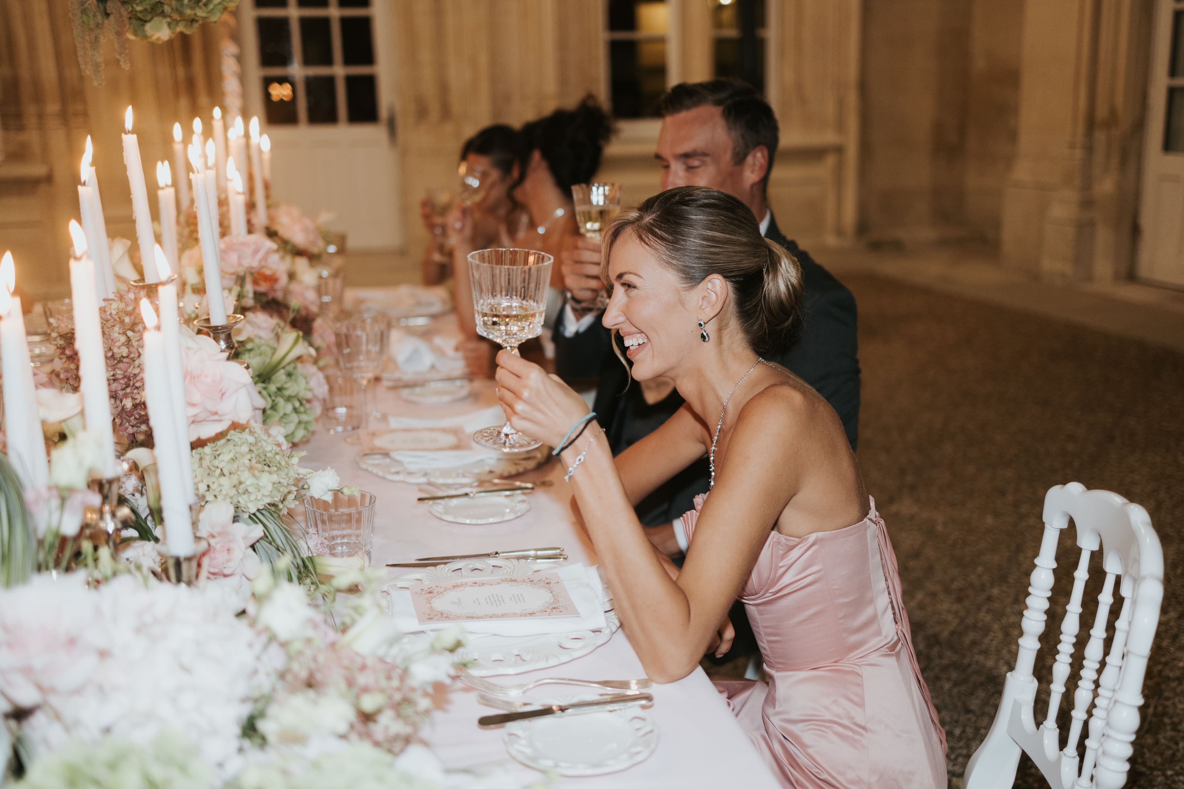The couple toasting at dinner